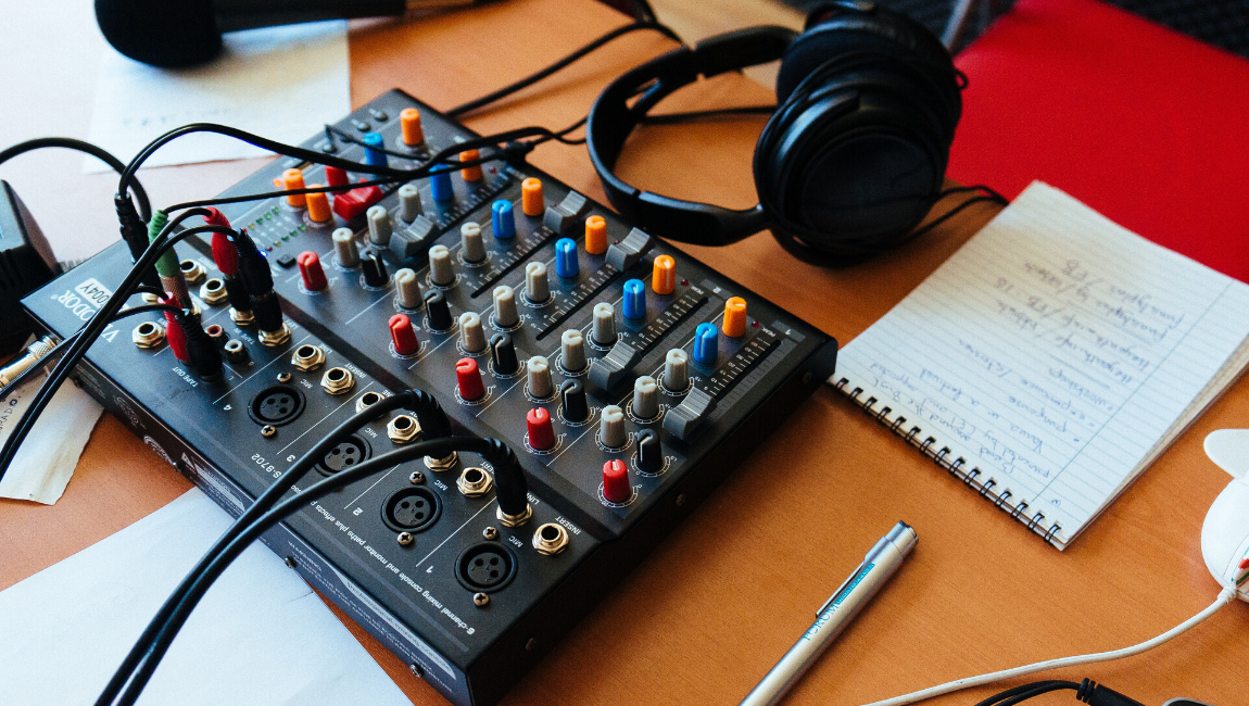 Soundboard and notebook sitting on a desk